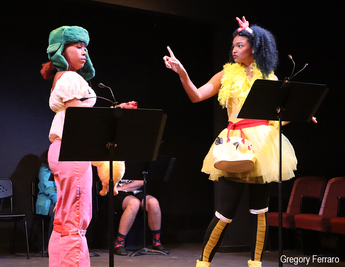 students rehearsing in theater