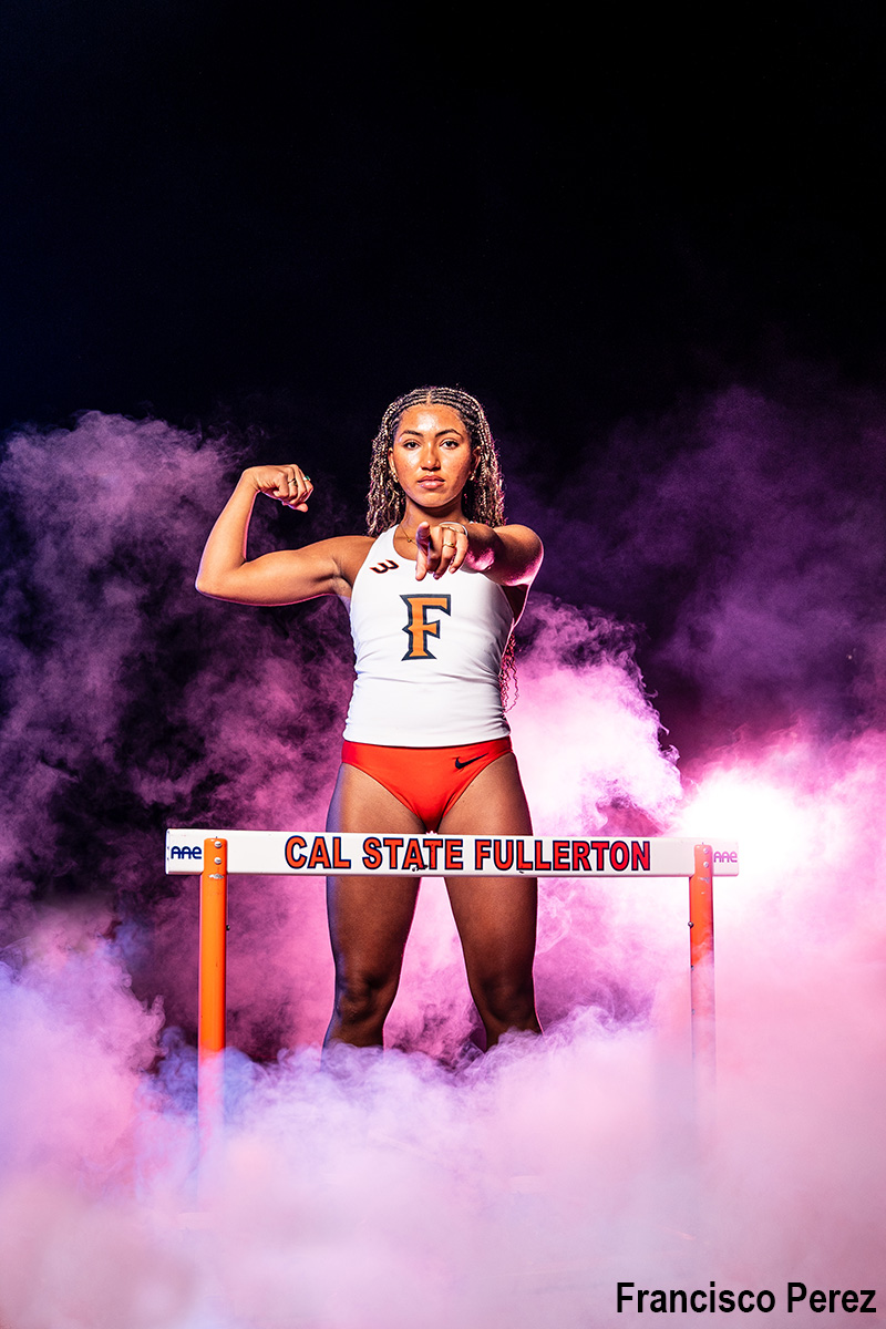 athlete in front of hurdle